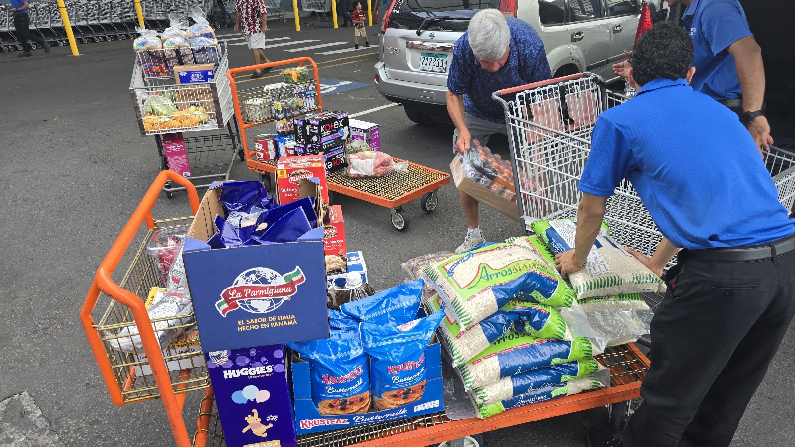 Volunteers loading groceries for community food distribution in Panama